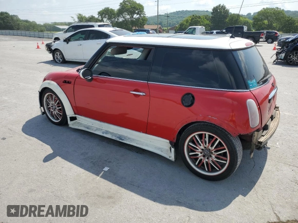 2004 MINI Hardtop with VIN WMWRC33444TC50103, listed as a Copart auction lot 63449615 with 144,467 mi miles and Salvage title. Bid and sale history available at DreamBid. Image 2.