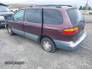 1999 Toyota Sienna LE with VIN 4T3ZF13C7XU152879, listed as a IAAI auction lot 41974953 with 201,644 mi miles. Bid and sale history available at carsss.com. Image 3.