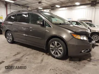 2016 Honda Odyssey Touring Elite with VIN 5FNRL5H92GB045824, listed as a IAAI auction lot 41872220 with 120,557 mi miles. Bid and sale history available at carsss.com. Image 1.