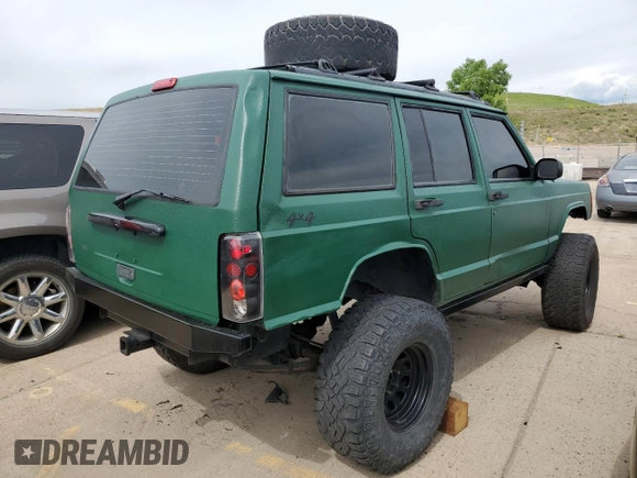 1998 Jeep Cherokee Sport with VIN 1J4FJ68SXWL210381, listed as a Copart auction lot 58398995 with 211,870 mi miles and Salvage title. Bid and sale history available at DreamBid. Image 3.