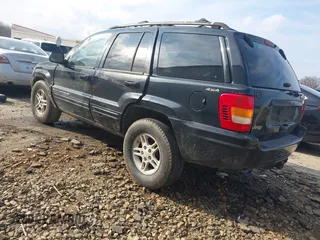 1999 Jeep Grand Cherokee Limited with VIN 1J4GW68S8XC588500, listed as a IAAI auction lot 41484787 with 161,961 mi miles. Bid and sale history available at carsss.com. Image 3.