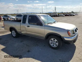 2000 Nissan Frontier XE with VIN 1N6DD26S7YC430643, listed as a Copart auction lot 59386765 with 204,851 mi miles and Salvage title. Bid and sale history available at DreamBid. Image 4.