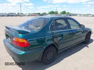 1999 Honda Civic LX z VIN 1HGEJ6672XL044666, wystawiony jako IAAI lot #42343700 z przebiegiem 144 445 mil mil oraz . Historia ofert i sprzedaży dostępna na DreamBid. Obrazek 4.