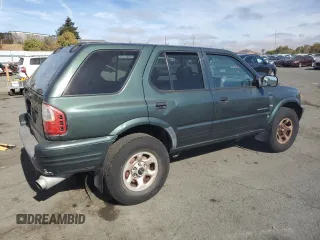 2004 Isuzu Rodeo S with VIN 4S2CK58W344303242, listed as a Copart auction lot 75339714 with 106,659 mi miles and Salvage title. Bid and sale history available at DreamBid. Image 3.