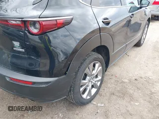 2021 Mazda CX-30 Preferred z VIN 3MVDMBCL5MM205824, wystawiony jako IAAI lot #41991942 z przebiegiem 58 112 mil mil oraz . Historia ofert i sprzedaży dostępna na DreamBid. Obrazek 6.