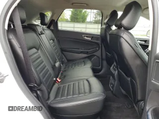 2020 Ford Edge SEL z VIN 2FMPK3J90LBB01559, wystawiony jako Copart lot #61365305 z przebiegiem 120 050 mil mil oraz Czysty tytuł • Clean title. Historia ofert i sprzedaży dostępna na DreamBid. Obrazek 11.