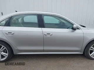 2014 Volkswagen Passat SE z VIN 1VWBN7A3XEC022098, wystawiony jako IAAI lot #42130334 z przebiegiem 88 433 mil mil oraz . Historia ofert i sprzedaży dostępna na DreamBid. Obrazek 13.