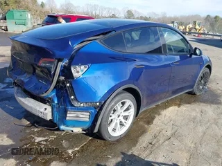 2023 Tesla Model Y Long Range with VIN 7SAYGDEE4PA042757, listed as a IAAI auction lot 41652541 with 48,569 mi miles. Bid and sale history available at carsss.com. Image 4.