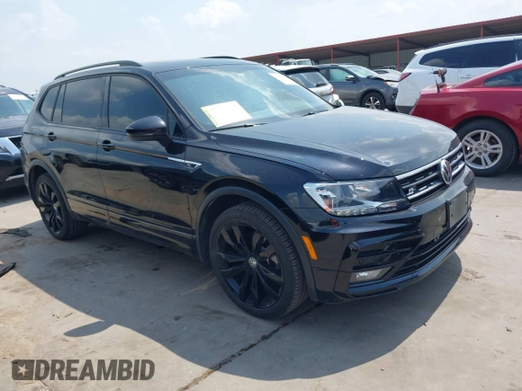 2021 Volkswagen Tiguan SE z VIN 3VV3B7AX0MM047478, wystawiony jako IAAI lot #42144239 z przebiegiem 55 468 mil mil oraz . Historia ofert i sprzedaży dostępna na DreamBid. Obrazek 1.