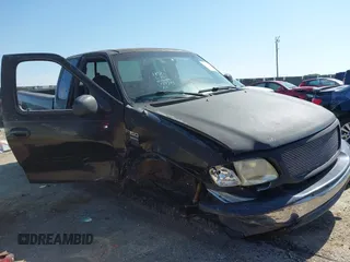 1999 Ford F-150 XL with VIN 1FTRX18L3XKA77743, listed as a IAAI auction lot 42512532 with Not provided miles and . Bid and sale history available at DreamBid. Image 6.