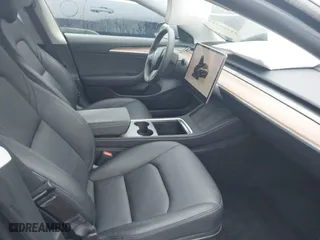 2023 Tesla Model 3 with VIN 5YJ3E1EA7PF642913, listed as a IAAI auction lot 41898249 with 26,394 mi miles. Bid and sale history available at carsss.com. Image 5.