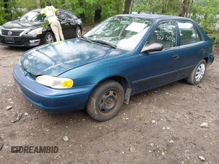 2000 Chevrolet Prizm LSi z VIN 1Y1SK5289YZ401584, wystawiony jako IAAI lot #42263210 z przebiegiem 151 567 mil mil oraz . Historia ofert i sprzedaży dostępna na DreamBid. Obrazek 2.