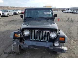 2002 Jeep Wrangler Sport with VIN 1J4FA49S32P758082, listed as a Copart auction lot 80692073 with 148,784 mi miles and Salvage Title. Bid and sale history available at carsss.com. Image 5.
