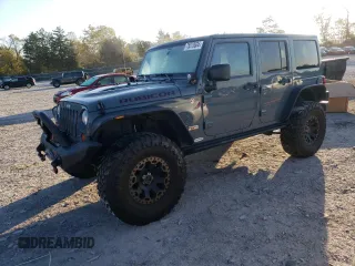 2013 Jeep Wrangler Unlimited Rubicon 10th Anniversary with VIN 1C4HJWFG0DL704100, listed as a Copart auction lot 75573634 with 103,158 mi miles and Salvage title. Bid and sale history available at DreamBid. Image 1.