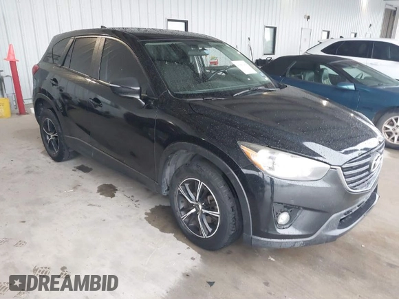 2016 Mazda CX-5 Touring with VIN JM3KE2CY2G0808424, listed as a IAAI auction lot 41880494 with 149,005 mi miles. Bid and sale history available at carsss.com. Image 1.