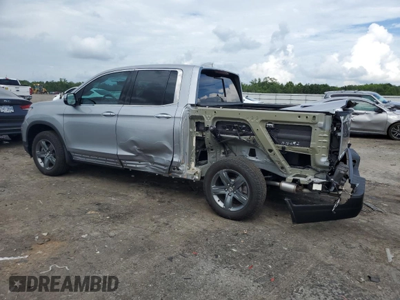 2023 Honda Ridgeline RTL-E with VIN 5FPYK3F70PB018858, listed as a Copart auction lot 64210205 with 16,562 mi miles and Salvage title. Bid and sale history available at DreamBid. Image 2.