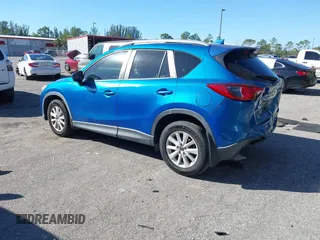 2014 Mazda CX-5 Touring with VIN JM3KE2CYXE0310873, listed as a IAAI auction lot 41309633 with 175,325 mi miles and . Bid and sale history available at DreamBid. Image 3.