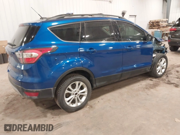 2017 Ford Escape SE z VIN 1FMCU0G90HUA94581, wystawiony jako IAAI lot #41396965 z przebiegiem 104 978 mil mil oraz . Historia ofert i sprzedaży dostępna na DreamBid. Obrazek 4.