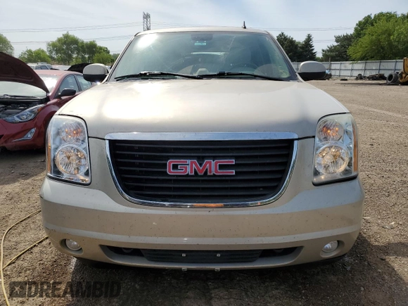 2007 GMC Yukon SLT with VIN 1GKFK13057J305802, listed as a Copart auction lot 57156884 with 218,494 mi miles and Salvage Title. Bid and sale history available at carsss.com. Image 5.