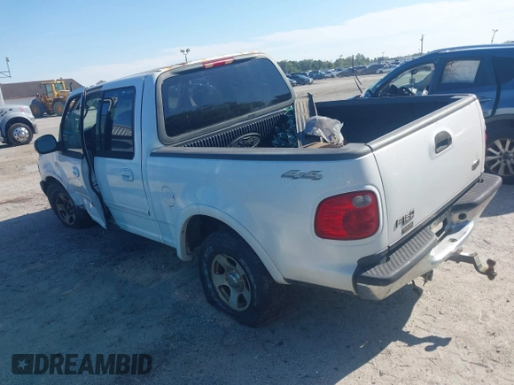 2002 Ford F-150 XLT with VIN 1FTRW08612KD90354, listed as a IAAI auction lot 41308528 with 207,261 mi miles. Bid and sale history available at carsss.com. Image 3.
