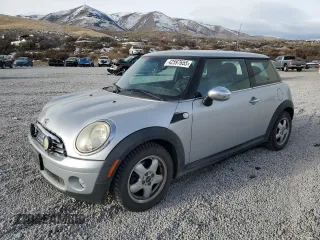 2010 MINI Hardtop with VIN WMWMF3C51ATU79132, listed as a Copart auction lot 42597655 with 116,041 mi miles and Salvage Title. Bid and sale history available at DreamBid. Image 1.