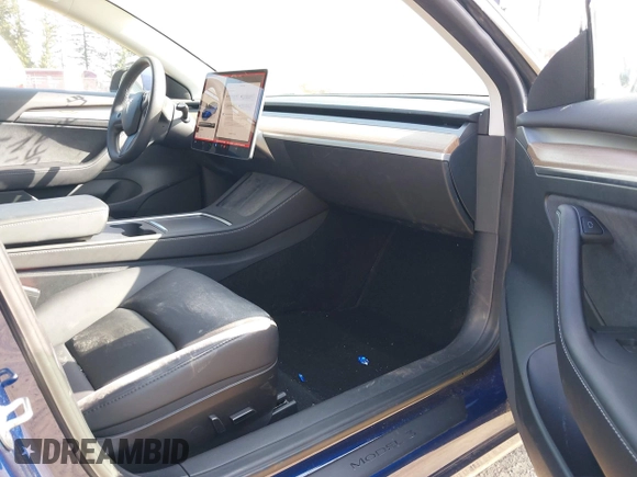 2023 Tesla Model 3 Performance with VIN 5YJ3E1EC2PF679613, listed as a IAAI auction lot 42099199 with 21,721 mi miles. Bid and sale history available at carsss.com. Image 5.