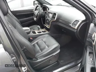 2014 Jeep Grand Cherokee Limited with VIN 1C4RJEBG0EC555774, listed as a IAAI auction lot 42160952 with 102,076 mi miles and . Bid and sale history available at DreamBid. Image 5.