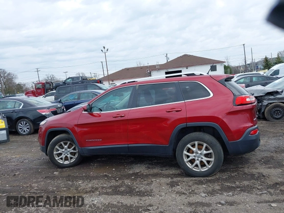 2014 Jeep Cherokee Latitude with VIN 1C4PJMCS0EW261021, listed as a IAAI auction lot 41986701 with 114,633 mi miles. Bid and sale history available at carsss.com. Image 11.