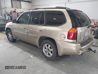 2004 GMC Envoy SLE with VIN 1GKDT13S442136464, listed as a IAAI auction lot 41874304 with 250,330 mi miles. Bid and sale history available at carsss.com. Image 3.