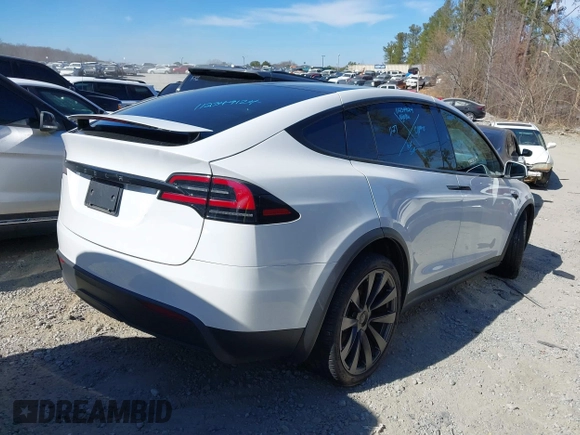 2023 Tesla Model X with VIN 7SAXCDE54PF430808, listed as a IAAI auction lot 41667924 with 21,100 mi miles and . Bid and sale history available at DreamBid. Image 4.