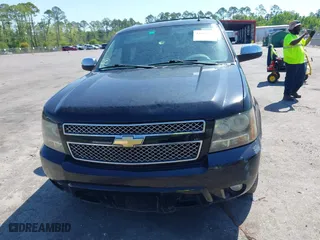 2011 Chevrolet Suburban LTZ with VIN 1GNSCKE01BR275919, listed as a IAAI auction lot 42038399 with 247,841 mi miles. Bid and sale history available at carsss.com. Image 12.