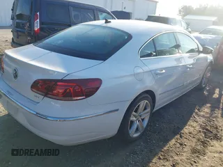2014 Volkswagen CC R-Line with VIN WVWBP7AN0EE504680, listed as a IAAI auction lot 41990269 with 137,660 mi miles. Bid and sale history available at carsss.com. Image 4.