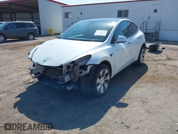 2021 Tesla Model Y Long Range with VIN 5YJYGDEE4MF122362, listed as a IAAI auction lot 42096138 with 47,006 mi miles and . Bid and sale history available at DreamBid. Image 2.