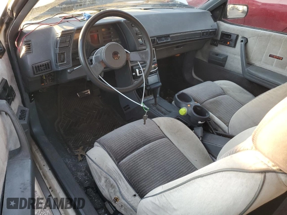 1988 Chevrolet Cavalier with VIN 1G1JF31WXJ7214292, listed as a Copart auction lot 87275184 with Not Provided miles and Salvage Title. Bid and sale history available at DreamBid. Image 8.