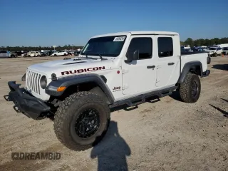 2022 Jeep Gladiator Rubicon с VIN 1C6JJTBG6NL142413, выставлен на аукционе Copart как лот 86098244 с пробегом 20 750 миль миль и Списание • Salvage title. История ставок и продаж доступна на DreamBid. Изображение 1.