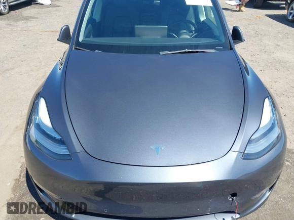 2022 Tesla Model Y Long Range with VIN 7SAYGDEE7NF426404, listed as a IAAI auction lot 42040490 with 39,635 mi miles and . Bid and sale history available at carsss.com. Image 10.
