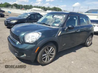 2012 MINI Countryman S with VIN WMWZC5C58CWM13401, listed as a Copart auction lot 62867145 with 95,502 mi miles and Salvage title. Bid and sale history available at DreamBid. Image 1.