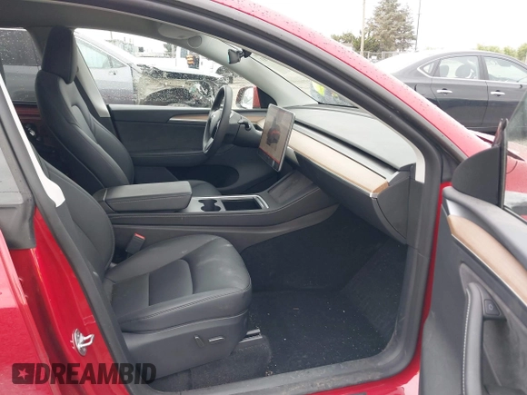 2023 Tesla Model Y Long Range with VIN 7SAYGDEE9PA145947, listed as a IAAI auction lot 42131783 with 4,956 mi miles and . Bid and sale history available at DreamBid. Image 5.