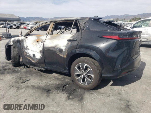 2024 Lexus RZ 300e Premium z VIN JTJABABB0RA004671, wystawiony jako Copart lot #57287935 z przebiegiem Nie podano mil oraz Nie do naprawy • Non repairable. Historia ofert i sprzedaży dostępna na DreamBid. Obrazek 2.