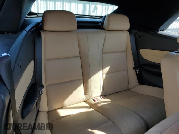 2011 BMW 1 Series 128i z VIN WBAUN1C58BVH83316, wystawiony jako Copart lot #52427935 z przebiegiem 89 781 mil mil oraz Szkoda całkowita • Salvage title. Historia ofert i sprzedaży dostępna na DreamBid. Obrazek 10.