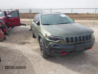 2021 Jeep Cherokee Trailhawk z VIN 1C4PJMBX6MD161982, wystawiony jako IAAI lot #41620867 z przebiegiem 54 471 mil mil oraz . Historia ofert i sprzedaży dostępna na DreamBid. Obrazek 1.
