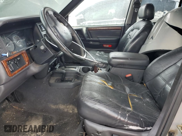 1997 Jeep Grand Cherokee Limited with VIN 1J4GZ78Y1VC706353, listed as a Copart auction lot 41437085 with 163,675 mi miles and Salvage Title. Bid and sale history available at carsss.com. Image 7.
