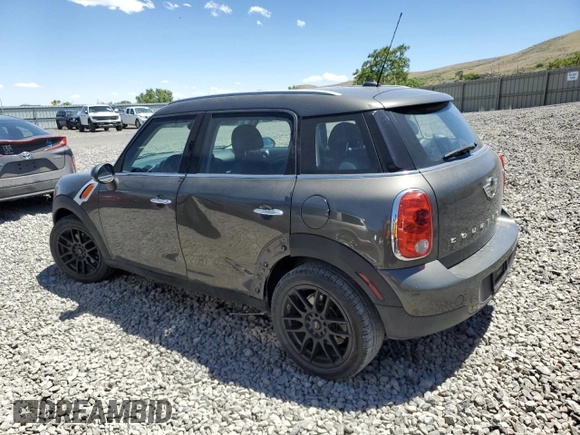 2014 MINI Countryman with VIN WMWZB3C56EWR38919, listed as a Copart auction lot 61385865 with 127,368 mi miles and Salvage title. Bid and sale history available at DreamBid. Image 2.