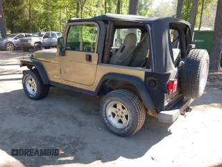 2003 Jeep Wrangler Sport z VIN 1J4FA49S13P313180, wystawiony jako IAAI lot #42349673 z przebiegiem 141 073 mil mil oraz . Historia ofert i sprzedaży dostępna na DreamBid. Obrazek 3.