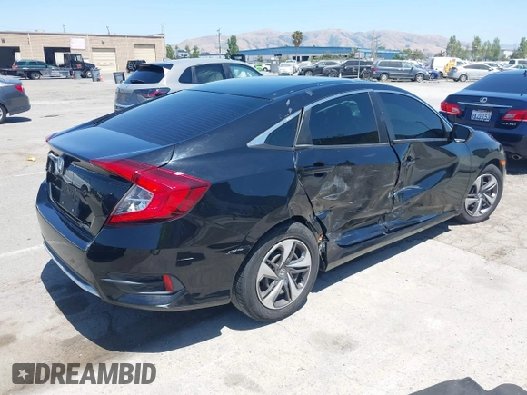 2020 Honda Civic LX with VIN 19XFC2F66LE213975, listed as a IAAI auction lot 42398098 with 69,902 mi miles and . Bid and sale history available at DreamBid. Image 4.