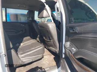2019 Chevrolet Suburban LT with VIN 1GNSCHKC3KR143942, listed as a IAAI auction lot 41896633 with 153,139 mi miles and . Bid and sale history available at DreamBid. Image 8.