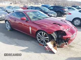 2008 Jaguar XK with VIN SAJWA43C089B22700, listed as a IAAI auction lot 41585734 with 67,946 mi miles. Bid and sale history available at carsss.com. Image 1.