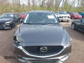 2020 Mazda CX-5 Touring with VIN JM3KFBCM8L0863951, listed as a IAAI auction lot 41921635 with 88,629 mi miles. Bid and sale history available at carsss.com. Image 6.