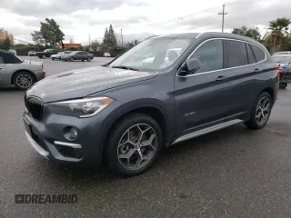 2018 BMW X1 xDrive28i with VIN WBXHT3C33J5K23187, listed as a Copart auction lot 71063192 with 97,403 mi miles. Bid and sale history available at carsss.com. Image 1.