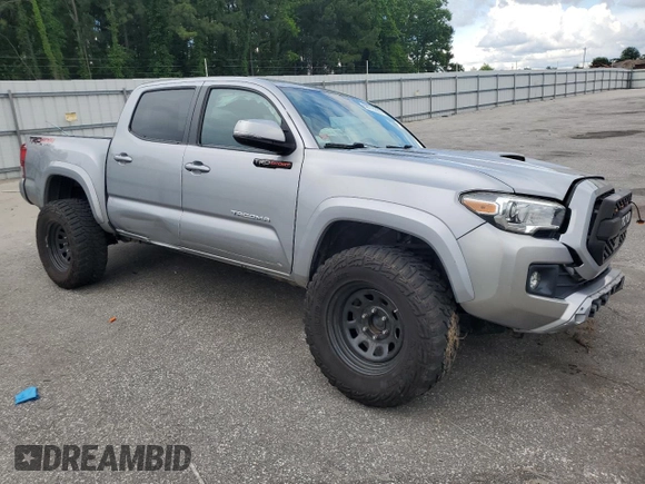 2019 Toyota Tacoma SR with VIN 3TMCZ5AN2KM193701, listed as a Copart auction lot 56776385 with 112,990 mi miles and Salvage title. Bid and sale history available at DreamBid. Image 4.